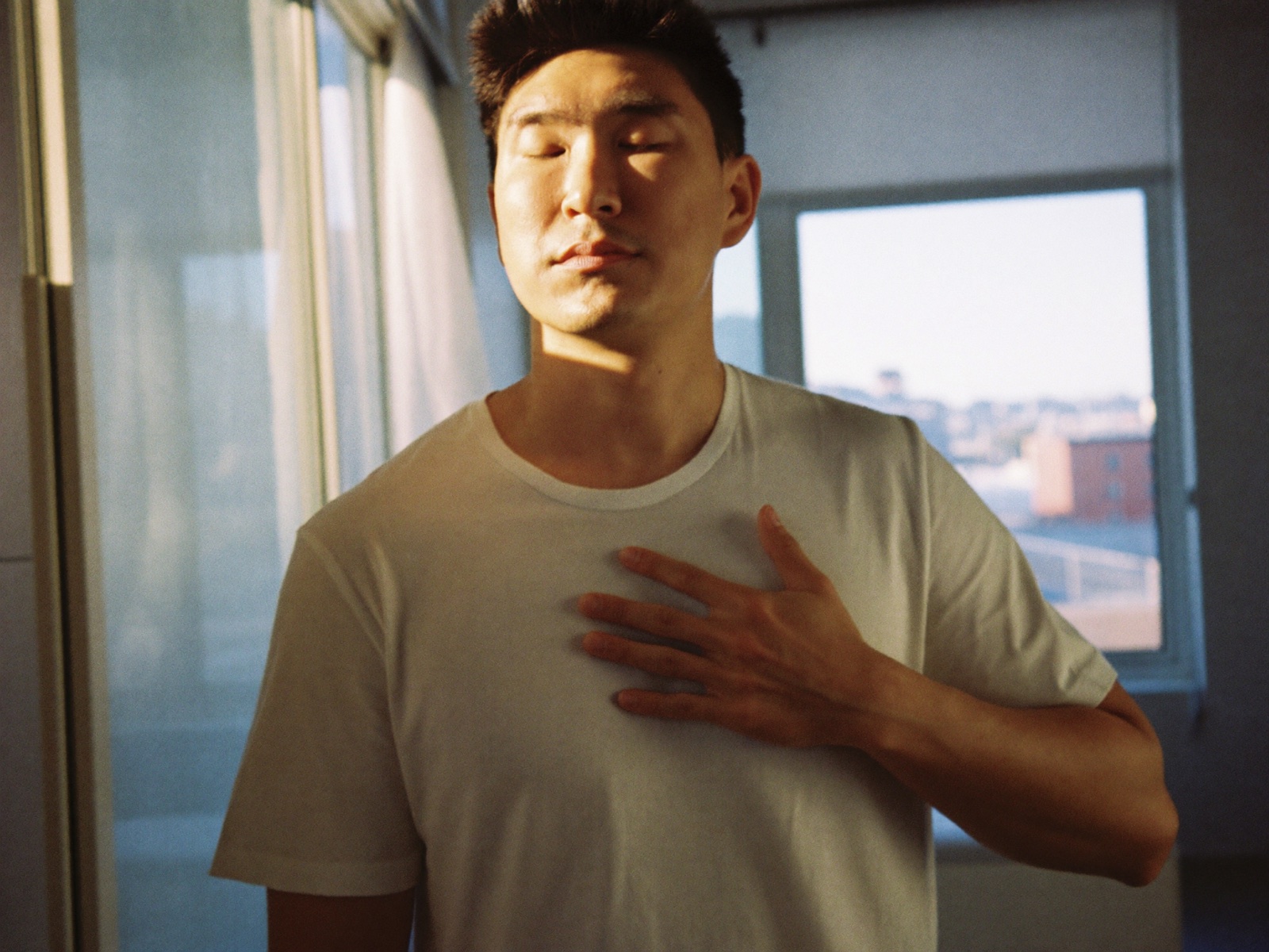 A man breathing out slowly, calm and relieved