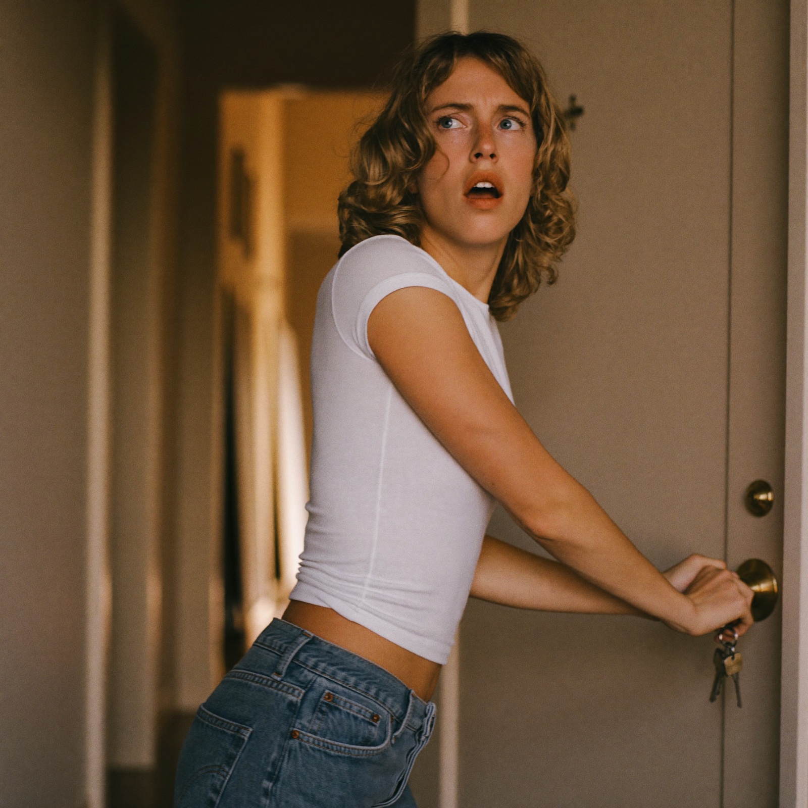 A woman stuck checking the front door again