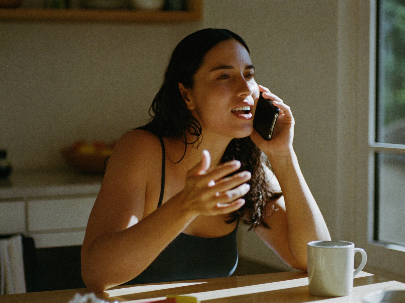 A woman talking things through with Steady over coffee