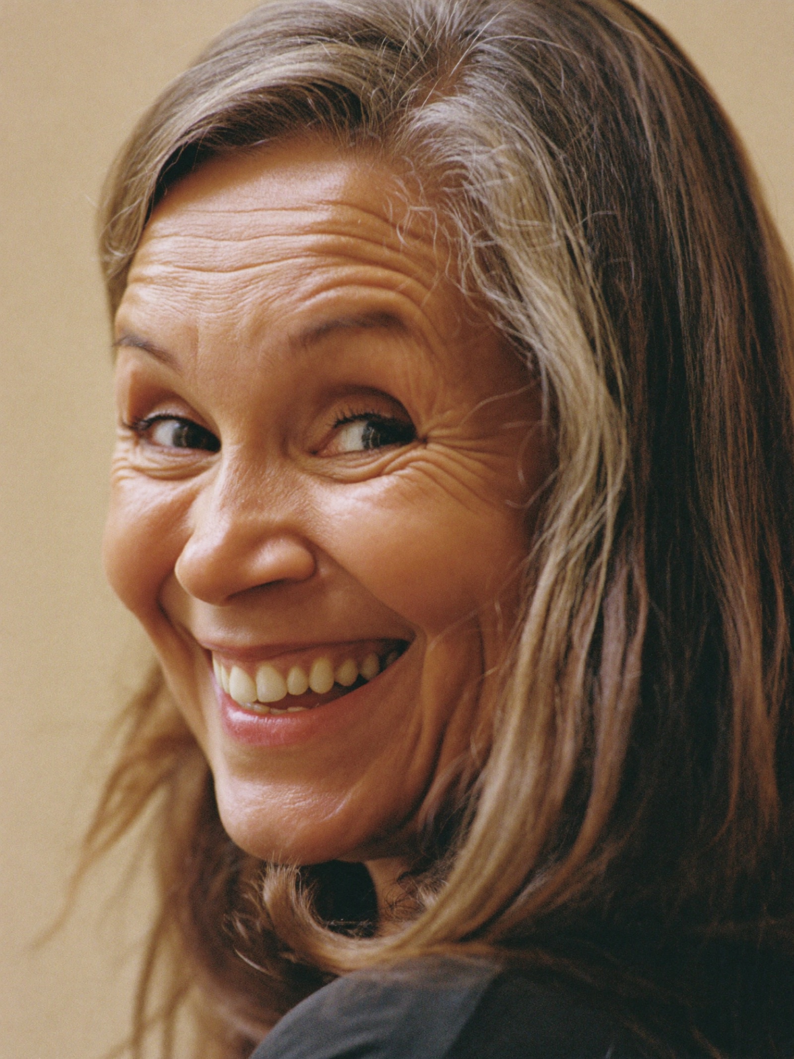 A woman with a warm smile